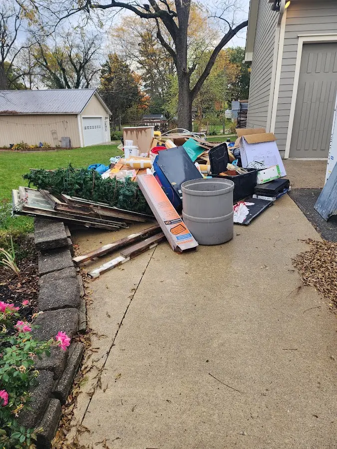 Dumpster being loaded with debris for Commercial Dumpster Rental in Santa Teresa